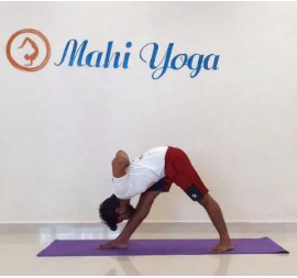 A man performing Parsvottanasana - Intense Side Stretch Pose during yoga practice.