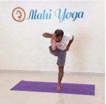 A man performing Utthita Hasta Padangusthasana B - Extended Hand-to-Big-Toe Pose variation during yoga practice.