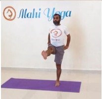 A man performing Utthita Hasta Padangusthasana D - Extended Hand-to-Big-Toe Pose advanced variation during yoga practice.