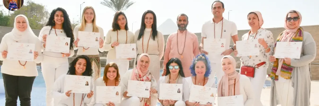 Group of certified yoga teachers proudly displaying certificates after completing yoga teacher training in India.