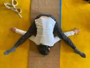 student performing yoga at mahi yoga center