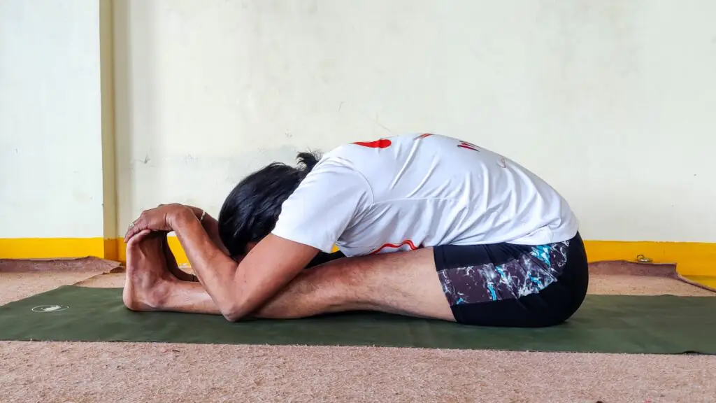 PASCHIMOTTANASANA - B (SITTING FORWARD BEND - B)